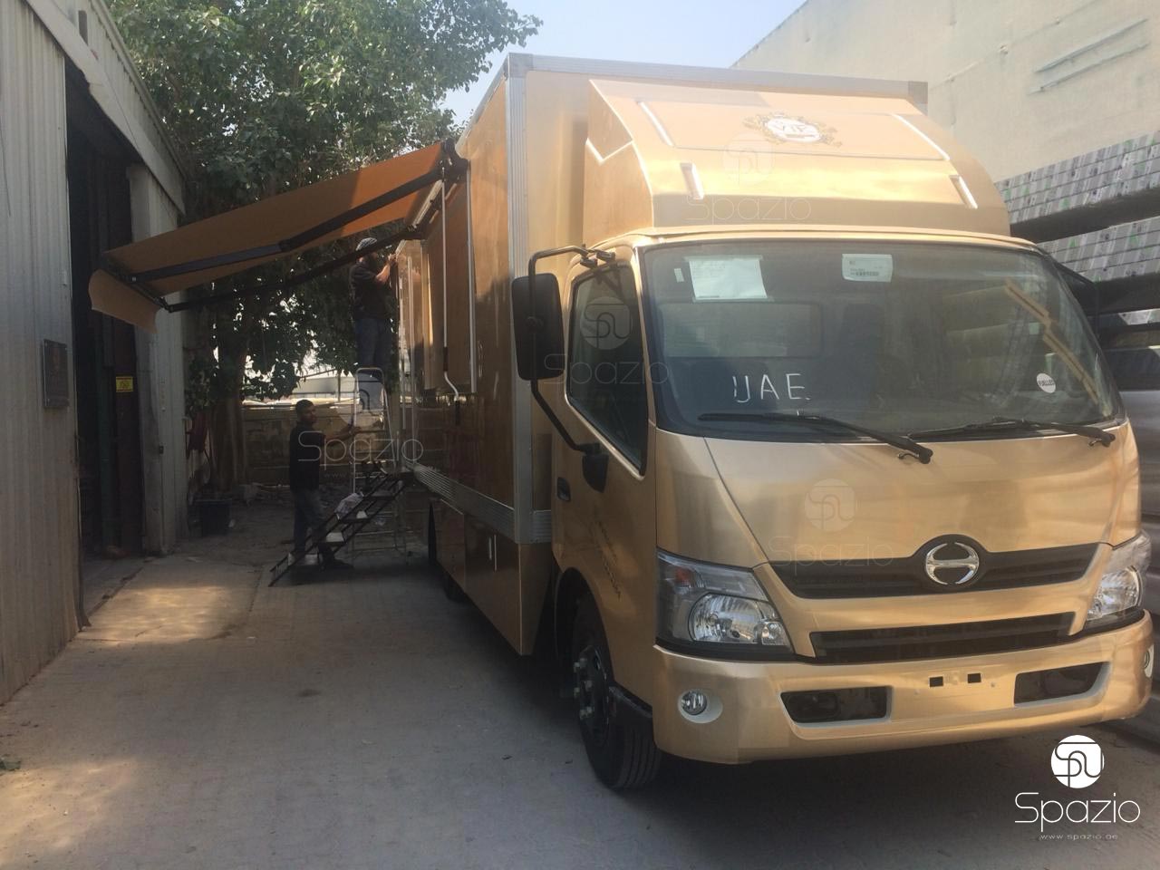 Luxury gold colored vehicle for hairdresser business in UAE.